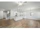 Open-concept living room and kitchen with a staircase at 733 Portland Rose Dr, Knightdale, NC 27545