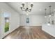 Bright, open-concept living room with backyard access and kitchen island at 733 Portland Rose Dr, Knightdale, NC 27545