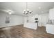 Open-concept living room and kitchen with modern stainless steel appliances at 733 Portland Rose Dr, Knightdale, NC 27545