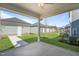 Covered patio featuring concrete floors and supporting beams, with a view of surrounding homes at 733 Portland Rose Dr, Knightdale, NC 27545