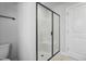Bathroom featuring a glass enclosed shower with white tile and modern fixtures at 733 Portland Rose Dr, Knightdale, NC 27545