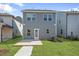 Rear exterior of house with a patio and lawn at 737 Portland Rose Dr, Knightdale, NC 27545