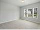 Spacious bedroom with three large windows at 737 Portland Rose Dr, Knightdale, NC 27545