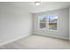 Bedroom with carpet and a double window offering natural light and exterior views at 737 Portland Rose Dr, Knightdale, NC 27545