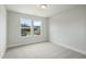 Bedroom with carpet and a double window offering natural light and exterior views at 737 Portland Rose Dr, Knightdale, NC 27545