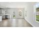 Bright dining room featuring stainless steel appliances, a back door with backyard view, and natural light at 737 Portland Rose Dr, Knightdale, NC 27545