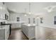 Open concept: kitchen with stainless appliances, light gray cabinets, and an island at 737 Portland Rose Dr, Knightdale, NC 27545