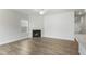 Living area with modern fireplace, ceiling fan, and plenty of natural light at 737 Portland Rose Dr, Knightdale, NC 27545