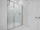 Bathroom showcasing a glass-enclosed shower with tile surround at 737 Portland Rose Dr, Knightdale, NC 27545