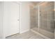 This bathroom has a glass-enclosed shower with tiled walls and floors at 76 Abingdon Farms Dr, Selma, NC 27576