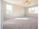 This spacious bedroom has neutral walls, soft carpet, and bright natural light at 76 Abingdon Farms Dr, Selma, NC 27576