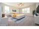 This staged bedroom features a king bed, a blue rug, and warm tones at 76 Abingdon Farms Dr, Selma, NC 27576