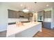 Modern kitchen with granite countertops, stainless steel appliances, and a large island, perfect for cooking and entertaining at 76 Abingdon Farms Dr, Selma, NC 27576