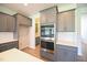 Contemporary kitchen featuring modern appliances, sleek cabinetry, and ample counter space for culinary enthusiasts at 76 Abingdon Farms Dr, Selma, NC 27576