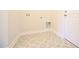 Laundry room with neutral paint, decorative tile floor, and utility connections at 76 Abingdon Farms Dr, Selma, NC 27576
