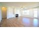 Spacious living room features hardwood floors, a cozy fireplace, and stylish built-in bookshelves at 76 Abingdon Farms Dr, Selma, NC 27576