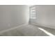 Bedroom featuring plush carpeting and a window providing natural light at 1660 Piney Falls Dr, Wendell, NC 27591