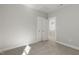This bedroom has a double closet, neutral light gray walls, carpet and white trim at 1660 Piney Falls Dr, Wendell, NC 27591