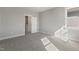 Bedroom with neutral gray colored walls, carpet, closet and a window at 1660 Piney Falls Dr, Wendell, NC 27591
