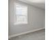 Bright bedroom showcasing a large window with natural light and neutral carpet flooring at 1660 Piney Falls Dr, Wendell, NC 27591