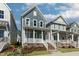 View of a two-story house highlighting its architectural style and landscaped surroundings at 1660 Piney Falls Dr, Wendell, NC 27591