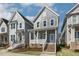 Exterior shot of a lovely two-story house with a welcoming front porch at 1660 Piney Falls Dr, Wendell, NC 27591