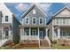 Charming two-story home with a welcoming front porch and well-manicured lawn, perfect for families at 1660 Piney Falls Dr, Wendell, NC 27591