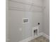 A utility room with a shelf, hot and cold water access, and a drain for a washing machine at 1660 Piney Falls Dr, Wendell, NC 27591