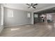 Spacious living room with hardwood floors connecting to a modern kitchen, perfect for entertaining at 1660 Piney Falls Dr, Wendell, NC 27591