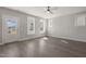 Inviting living room with wood floors, a ceiling fan, and natural light, creating a warm atmosphere at 1660 Piney Falls Dr, Wendell, NC 27591