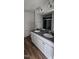 Modern bathroom features double sinks, gray countertops, white cabinets, and tiled shower at 19 Longdale Dr, Graham, NC 27253