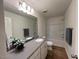Bright bathroom with a large mirror, modern vanity, and a combined shower and bathtub at 19 Longdale Dr, Graham, NC 27253