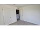 Carpeted bedroom includes two closets and an electrical outlet at 19 Longdale Dr, Graham, NC 27253