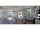 Spacious kitchen with island opens into the living area with sliding glass doors to the backyard at 19 Longdale Dr, Graham, NC 27253