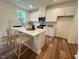 Bright kitchen features a central island, modern appliances, and ample cabinet space at 19 Longdale Dr, Graham, NC 27253