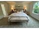 Serene main bedroom with a cozy bed, bedside tables, and soft, neutral tones at 19 Longdale Dr, Graham, NC 27253