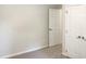 Simple bedroom with double door closet and neutral colored walls at 7220 Shellburne Dr, Raleigh, NC 27612