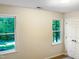 Bright bedroom with two windows and a closet at 7220 Shellburne Dr, Raleigh, NC 27612