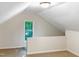 Bonus room with a window and knee wall at 7220 Shellburne Dr, Raleigh, NC 27612