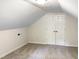 Spacious bonus room with double closet doors and carpet flooring at 7220 Shellburne Dr, Raleigh, NC 27612
