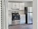 Kitchen with stainless steel appliances and white cabinets at 7220 Shellburne Dr, Raleigh, NC 27612