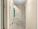 Upstairs hallway with neutral wall color and carpet at 7220 Shellburne Dr, Raleigh, NC 27612