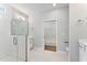 Modern bathroom featuring tiled floor, glass shower, and white vanity at 167 Thistle Ct, Sanford, NC 27332