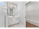 Bright bathroom featuring glass shower, and white vanity with storage at 167 Thistle Ct, Sanford, NC 27332