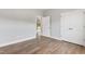 Bright bedroom featuring wood-look flooring, a double closet, and neutral paint at 167 Thistle Ct, Sanford, NC 27332