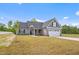 Charming single-Gathering home with a well-manicured lawn, two-car garage, and inviting curb appeal at 167 Thistle Ct, Sanford, NC 27332