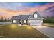 Beautiful home exterior with manicured lawn and modern gray color at 167 Thistle Ct, Sanford, NC 27332