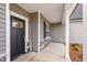 Welcoming front entryway with a stylish door, exterior trim, and a covered porch area at 167 Thistle Ct, Sanford, NC 27332