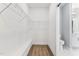 Clean walk-in closet featuring wire shelving and a built-in bench for optimal storage at 167 Thistle Ct, Sanford, NC 27332