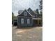 Stunning new construction featuring a blue exterior, stone accents, and an attached two car garage at , Pittsboro, NC 27312
